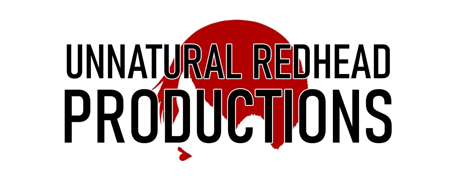 The Unnatural Redhead Productions logo, consisting of that text in black over a red profile silhouette of a woman's hair and lips.